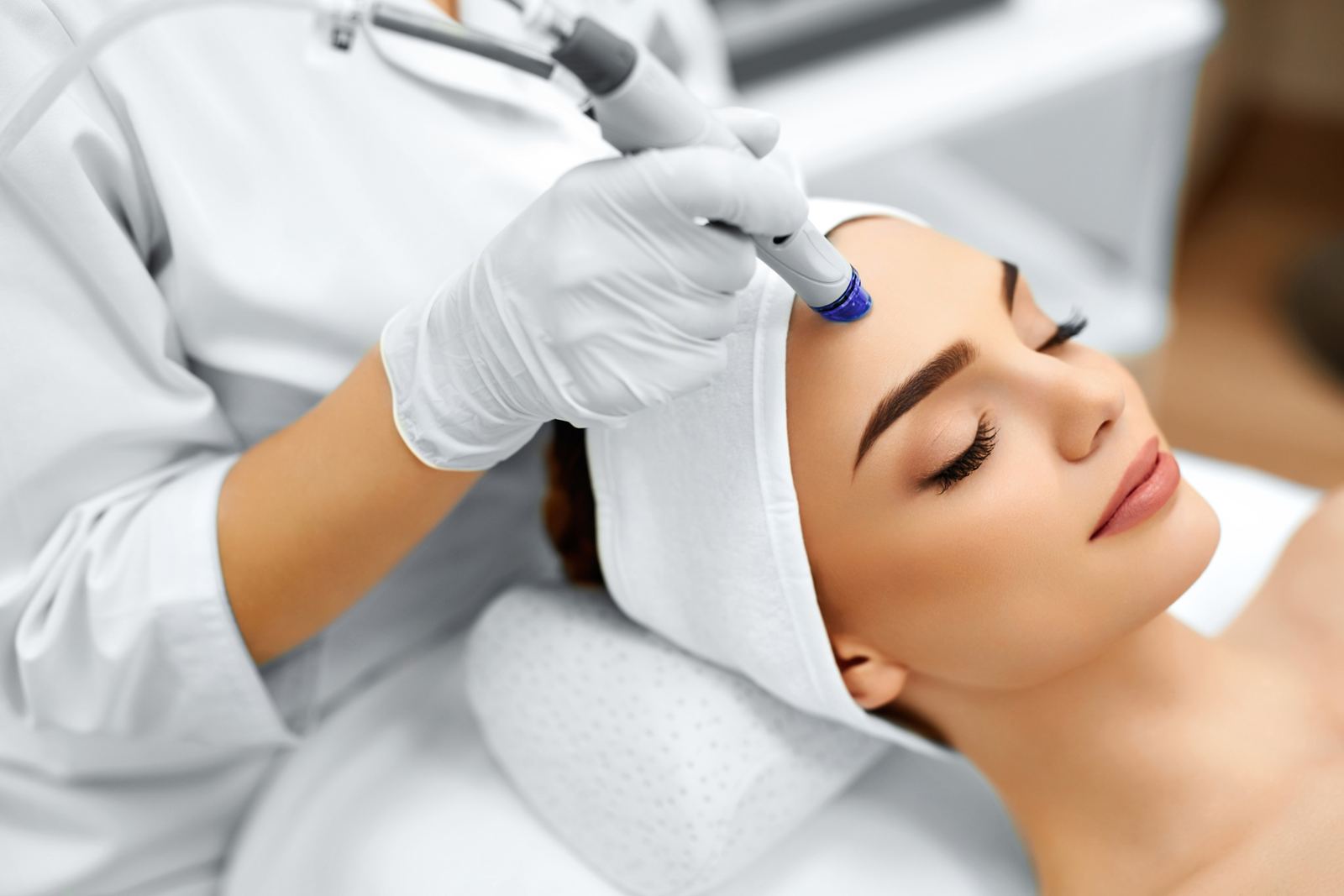 Hydradermabrasion handpiece treating the forehead